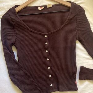 Western style. Dark brown Levi's button top.